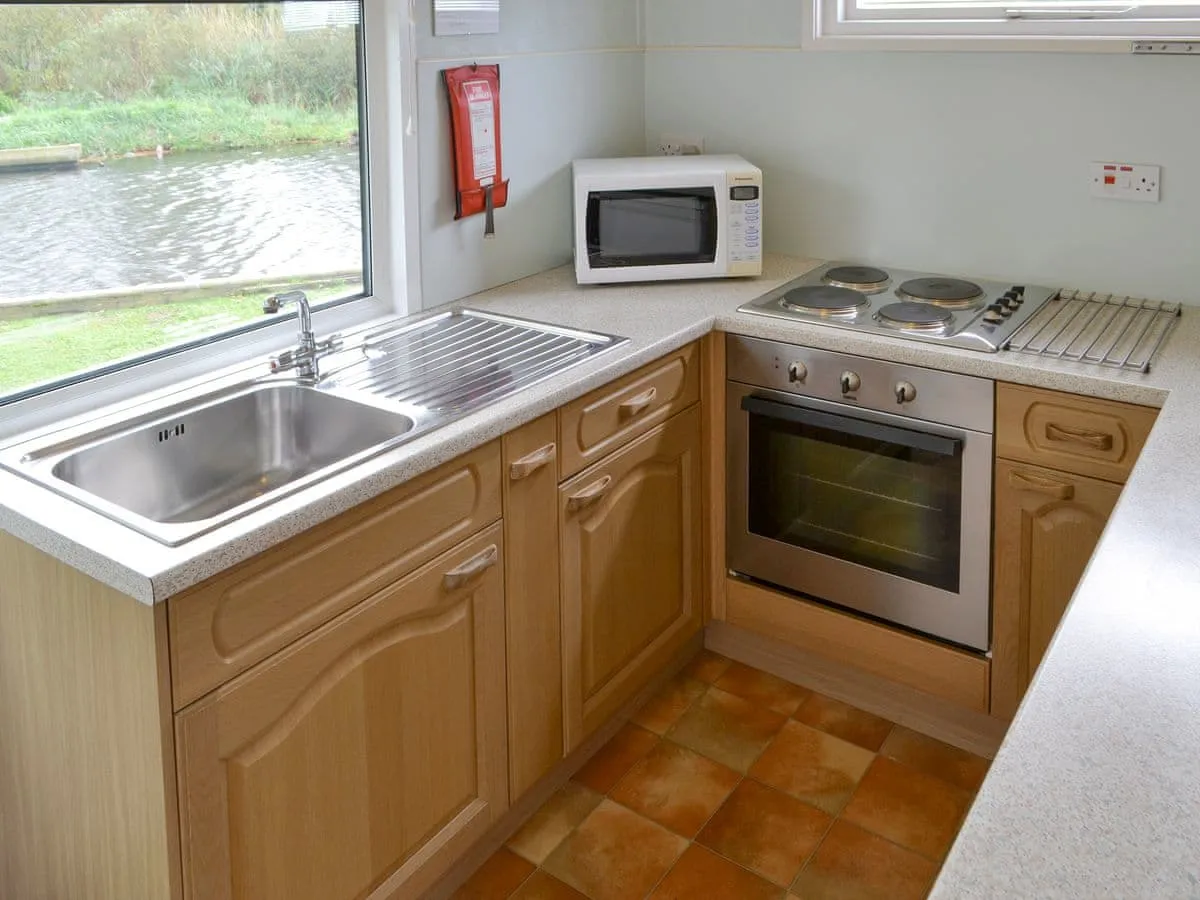 Fully equipped modern kitchen with a window onto the water